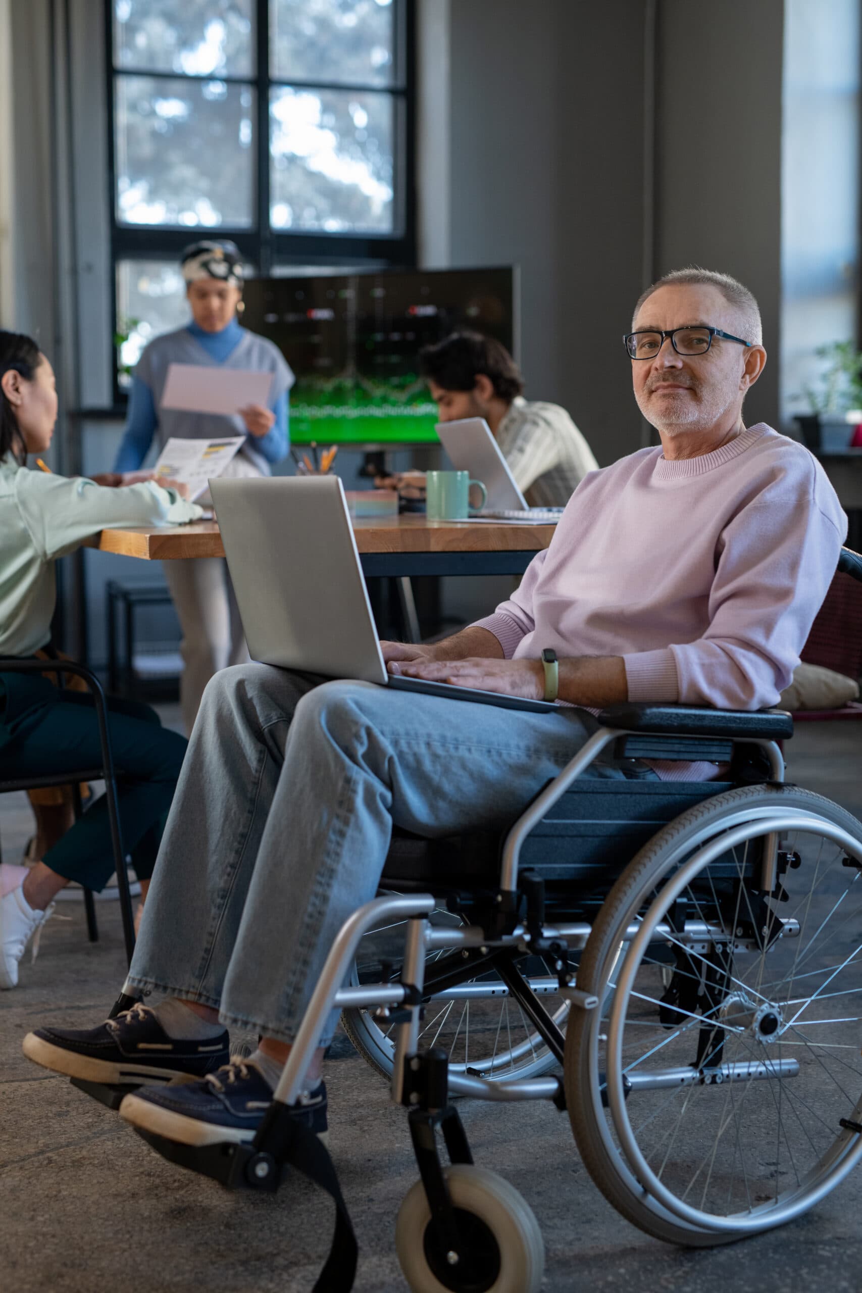 An NDIS provider team member working through structured compliance documentation