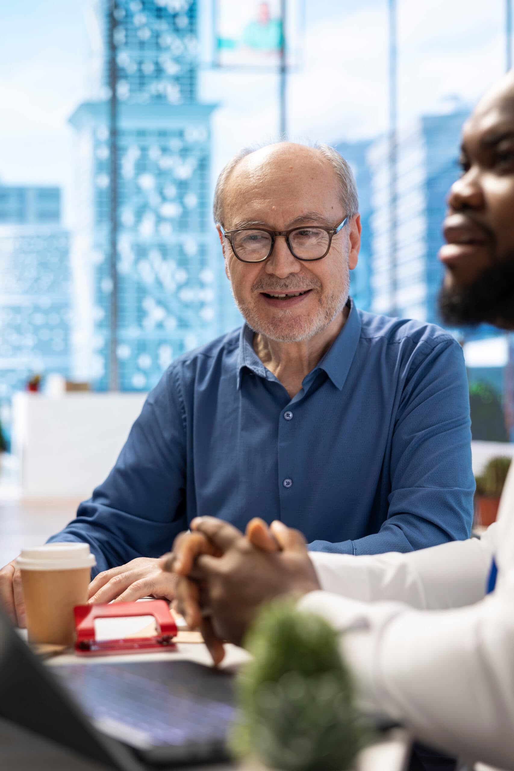 A manager reviewing business performance with their team
